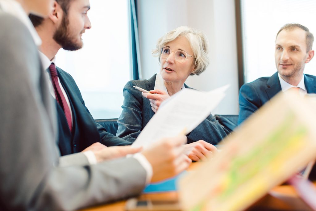 Experienced attorney with her team of professionals working on d