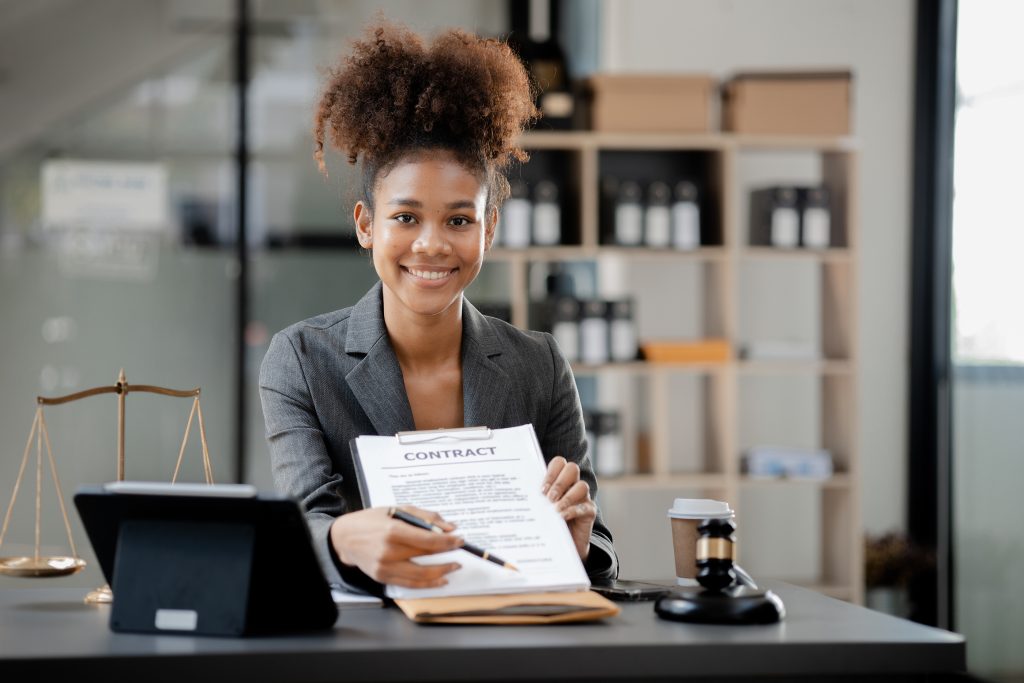 American Lawyer Sits In A Law Firm, Female Lawyer Holding A Cont